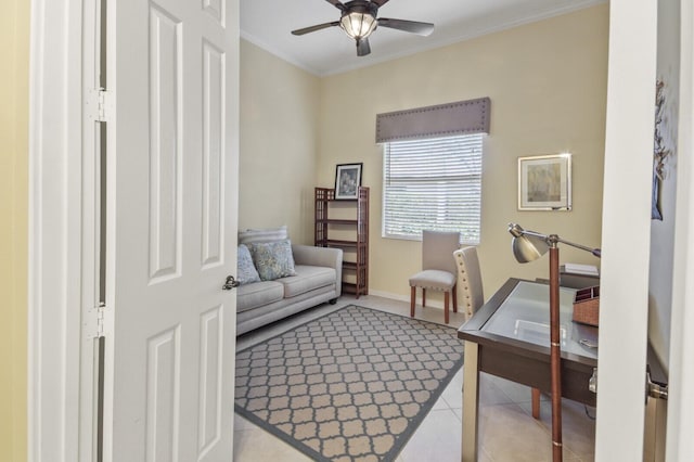 office area with light tile patterned floors, crown molding, baseboards, and ceiling fan