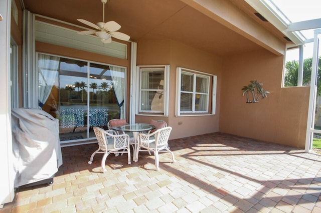 view of patio / terrace featuring a ceiling fan and outdoor dining space