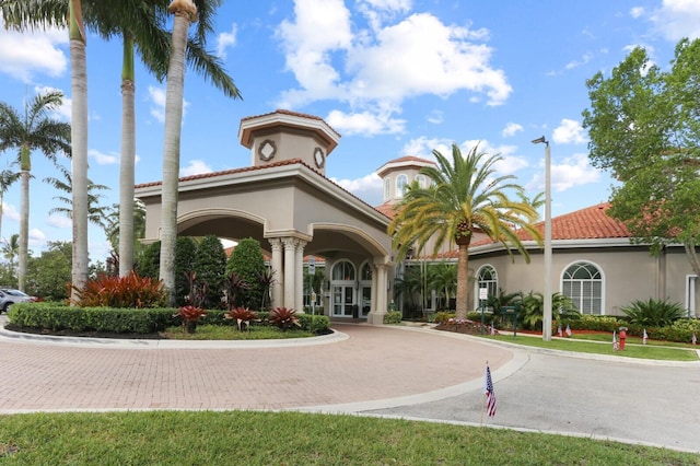 view of property with decorative driveway