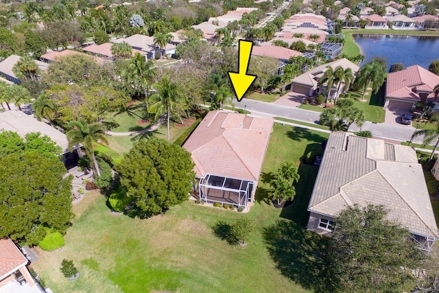 birds eye view of property featuring a residential view and a water view