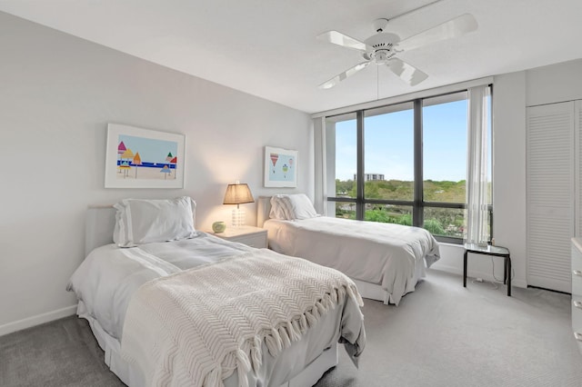 bedroom featuring carpet floors, ceiling fan, and baseboards