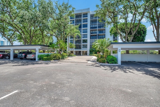 view of property featuring covered parking