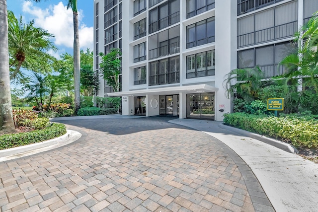 exterior space featuring decorative driveway