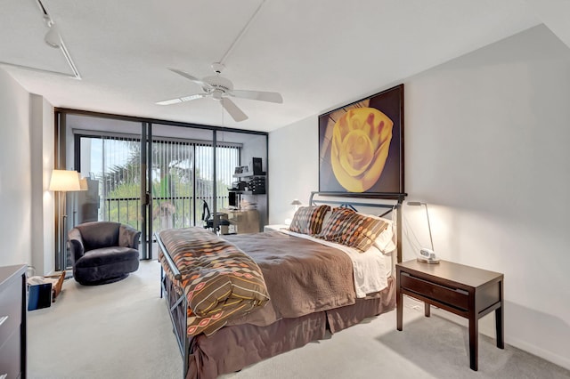 carpeted bedroom featuring access to exterior and ceiling fan