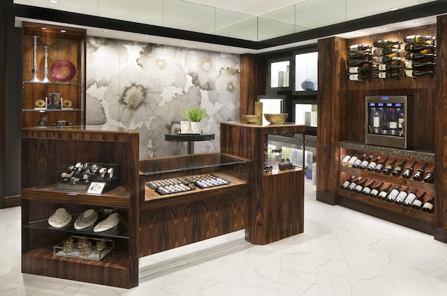 wine cellar featuring marble finish floor