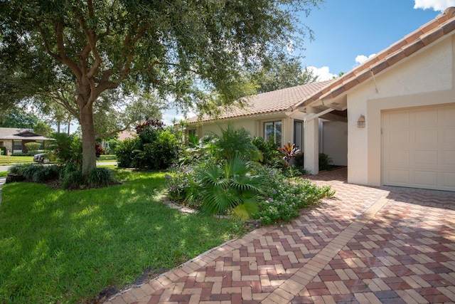 view of yard featuring an attached garage