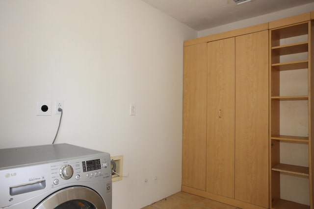 laundry area featuring laundry area, washer / clothes dryer, light tile patterned flooring, and visible vents