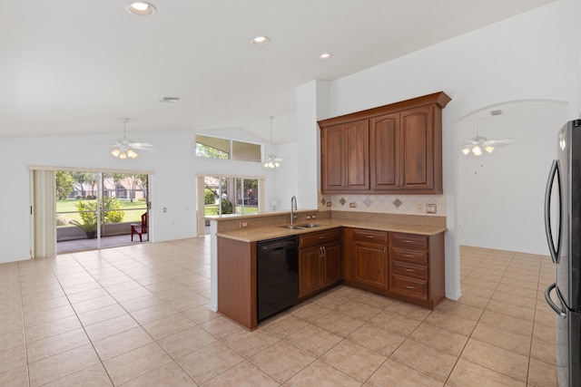 9081 Livorno St, Boynton Beach, FL 33472 - kitchen with black dishwasher, freestanding refrigerator, a ceiling fan, a sink, and open floor plan