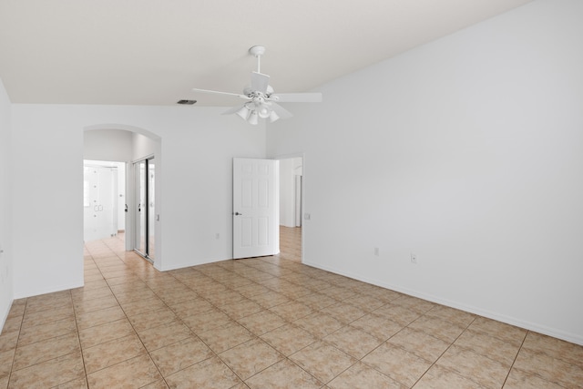 9081 Livorno St, Boynton Beach, FL 33472 - spare room with arched walkways, a ceiling fan, lofted ceiling, and baseboards