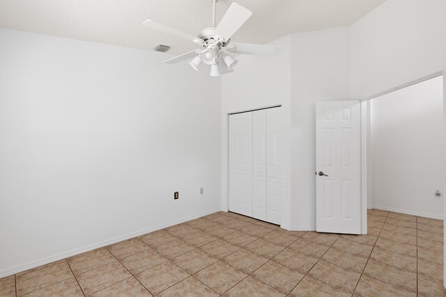 9081 Livorno St, Boynton Beach, FL 33472 - unfurnished bedroom featuring a closet, a towering ceiling, ceiling fan, and baseboards