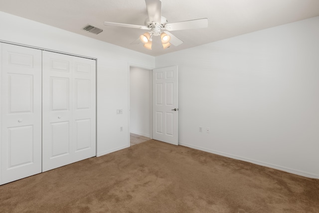 9081 Livorno St, Boynton Beach, FL 33472 - unfurnished bedroom featuring carpet flooring, a closet, baseboards, and a ceiling fan