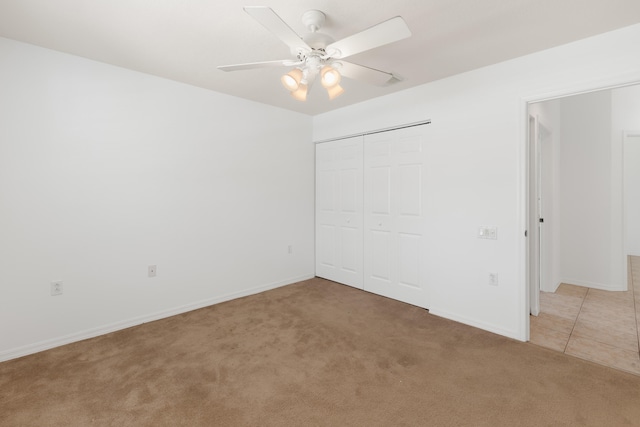 9081 Livorno St, Boynton Beach, FL 33472 - unfurnished bedroom with light carpet, baseboards, a closet, and ceiling fan