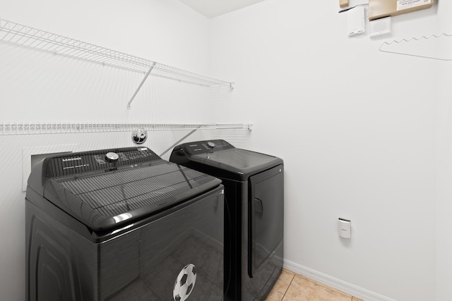 9081 Livorno St, Boynton Beach, FL 33472 - laundry area featuring washer and dryer, baseboards, and light tile patterned flooring