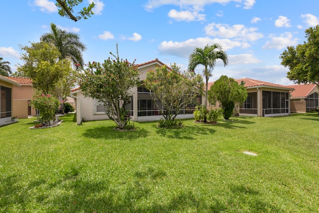 9081 Livorno St, Boynton Beach, FL 33472 - view of green lawn featuring a sunroom