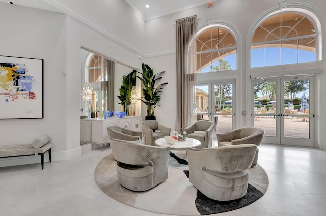 9081 Livorno St, Boynton Beach, FL 33472 - living area featuring french doors, a towering ceiling, recessed lighting, crown molding, and baseboards
