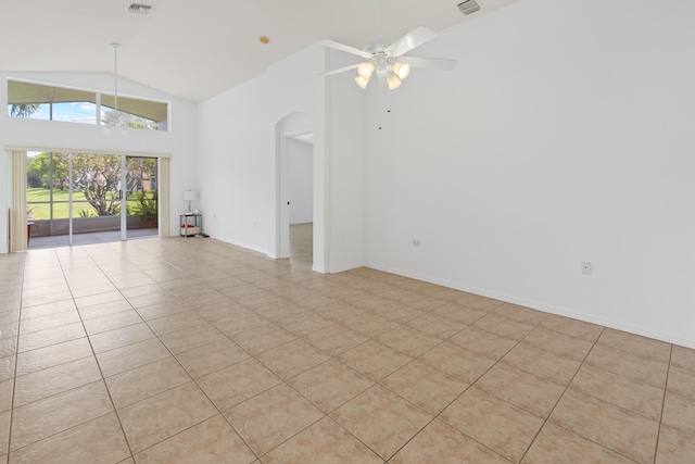 9081 Livorno St, Boynton Beach, FL 33472 - unfurnished living room with a ceiling fan, high vaulted ceiling, arched walkways, light tile patterned floors, and baseboards