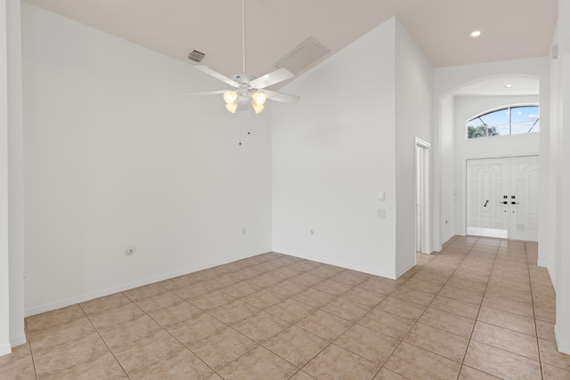 9081 Livorno St, Boynton Beach, FL 33472 - empty room with arched walkways, a ceiling fan, light tile patterned floors, and recessed lighting