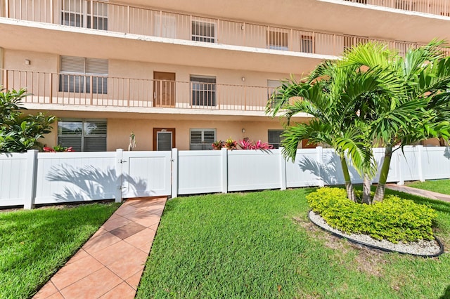 view of building exterior featuring fence private yard