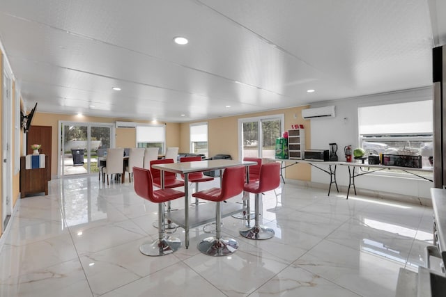 dining space featuring marble finish floor, a wall unit AC, and recessed lighting