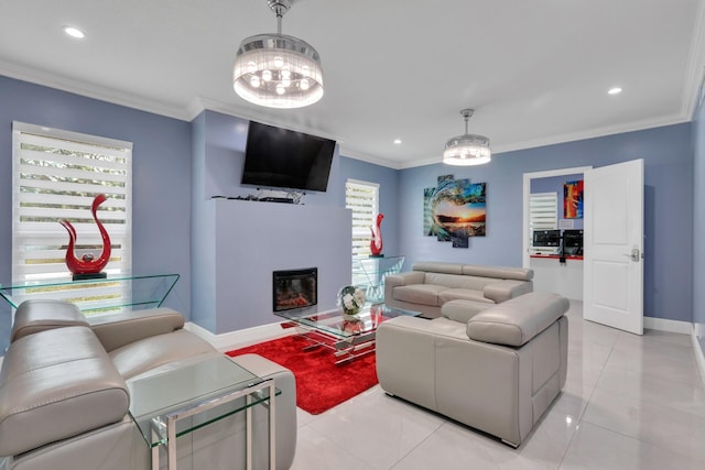 living area featuring recessed lighting, baseboards, crown molding, and a glass covered fireplace