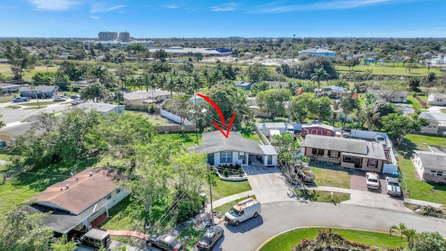 birds eye view of property with a residential view