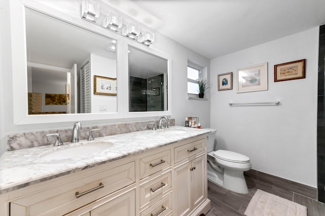 full bathroom featuring wood finish floors, a sink, toilet, and double vanity