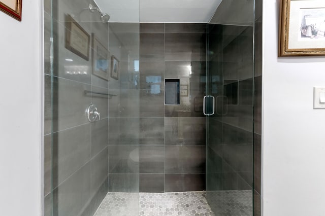 full bath with a shower stall