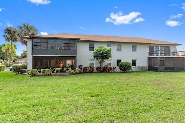 rear view of house with a yard