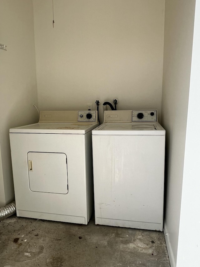 clothes washing area featuring laundry area and independent washer and dryer