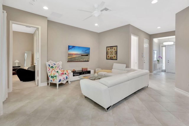 living room featuring light tile patterned flooring, visible vents, and recessed lighting