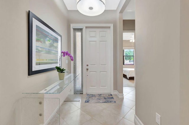 entryway with light tile patterned floors