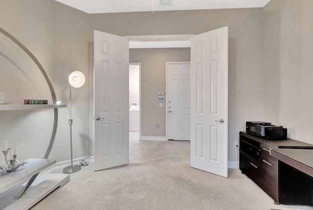 office space featuring light colored carpet and baseboards