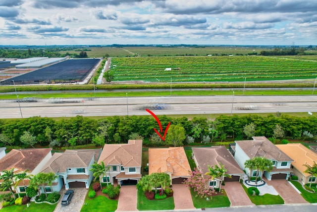 birds eye view of property featuring a residential view and a rural view