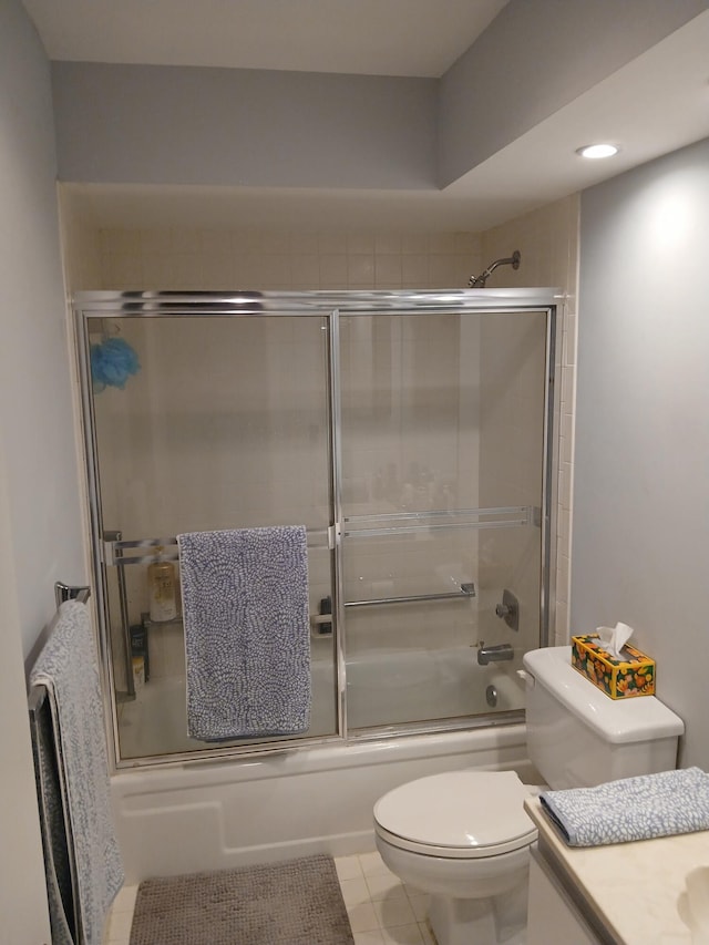 full bathroom with toilet, tile patterned floors, combined bath / shower with glass door, and vanity