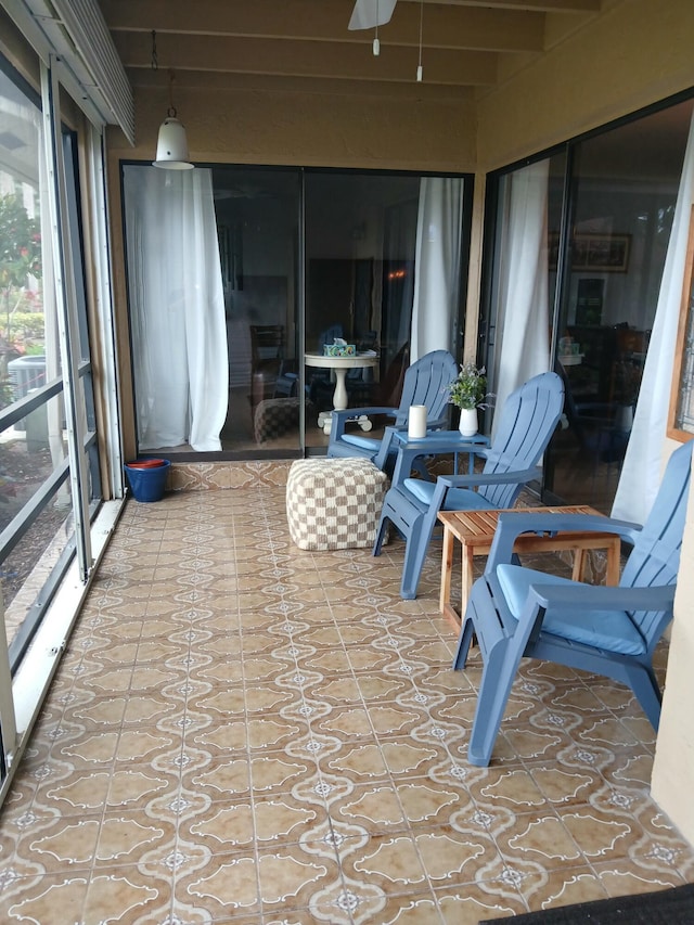 sunroom / solarium with ceiling fan