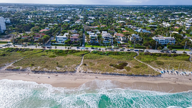 aerial view featuring a water view, a residential view, and a view of the beach