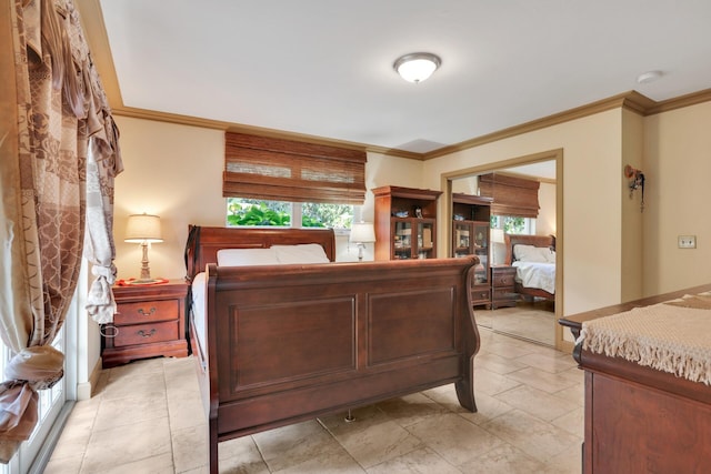 bedroom with ornamental molding, a closet, and multiple windows