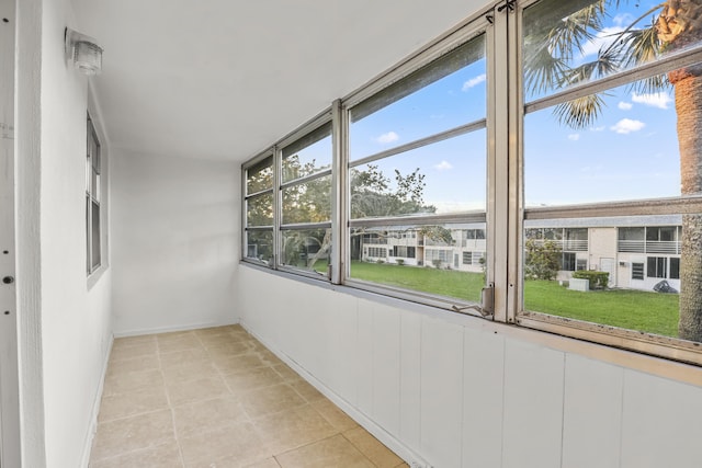 unfurnished sunroom featuring plenty of natural light