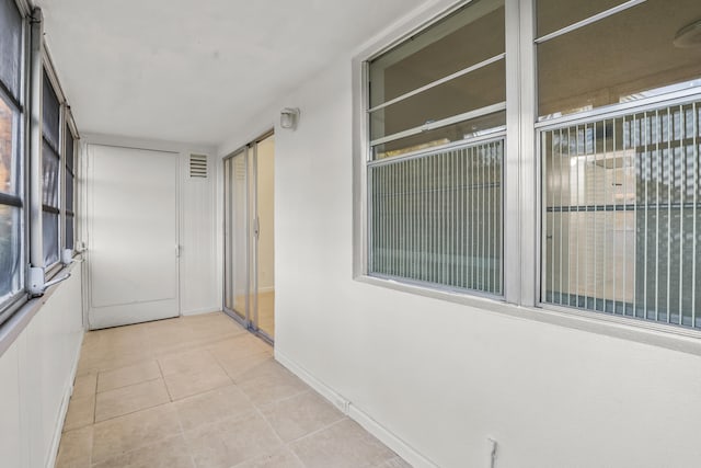 unfurnished sunroom with visible vents