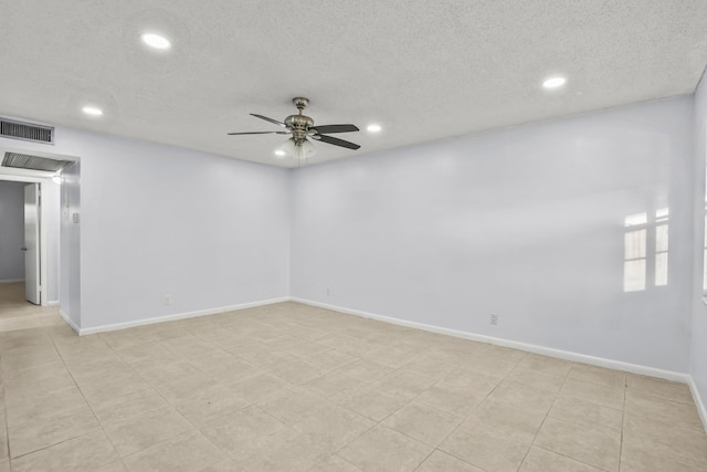 unfurnished room with ceiling fan, a textured ceiling, recessed lighting, visible vents, and baseboards