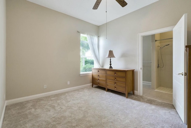 bedroom with a ceiling fan, baseboards, and light carpet