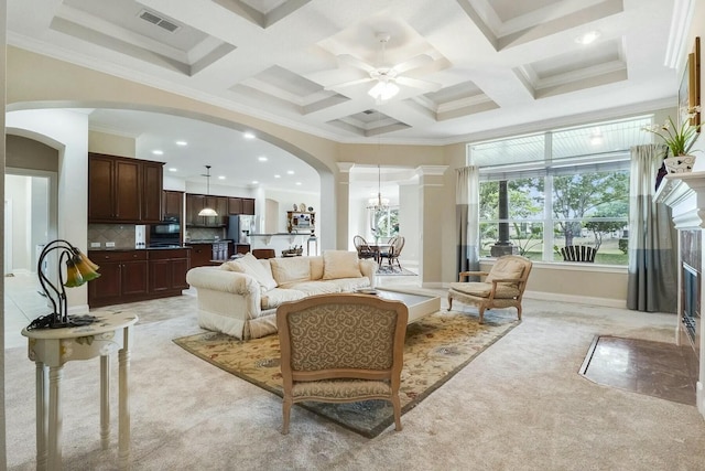 living room featuring light colored carpet, arched walkways, visible vents, and coffered ceiling