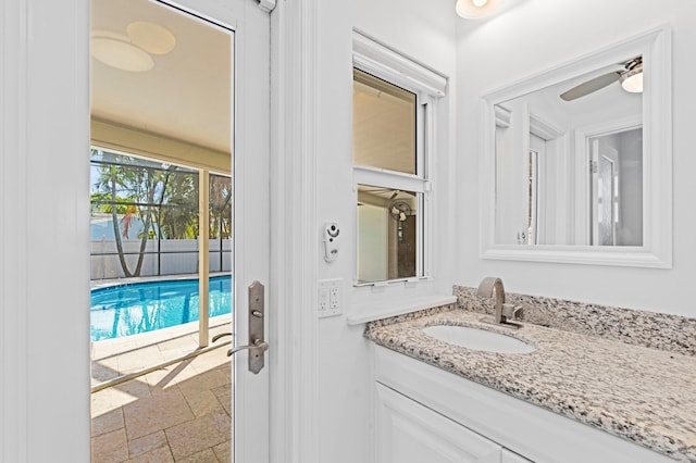 bathroom with vanity and stone tile flooring