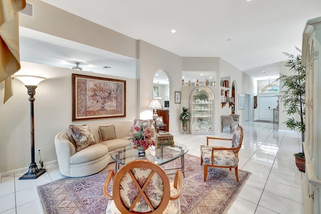 living room with light tile patterned floors, ceiling fan, recessed lighting, visible vents, and baseboards