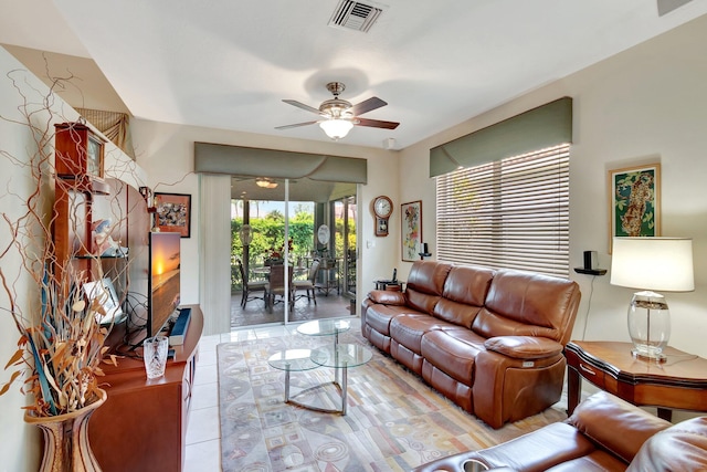 living area with ceiling fan and visible vents