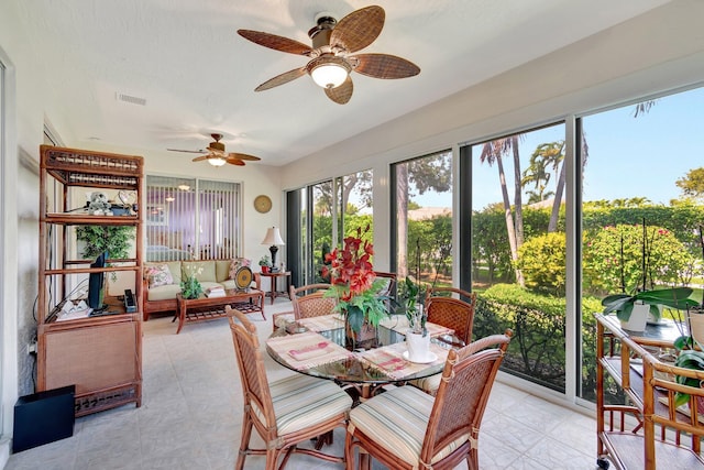 sunroom with visible vents and a ceiling fan