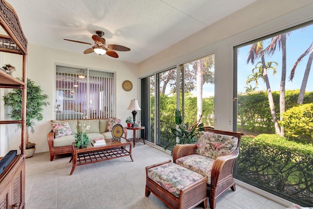 sunroom with a ceiling fan