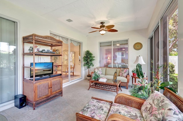 sunroom / solarium featuring ceiling fan and visible vents