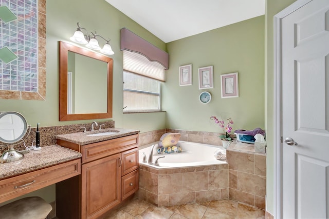 full bathroom with a garden tub, tile patterned flooring, and vanity