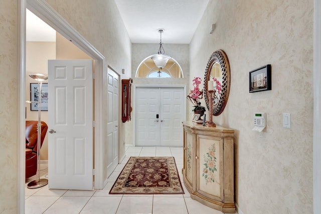 entryway with light tile patterned floors